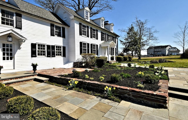 rear view of property featuring a patio area