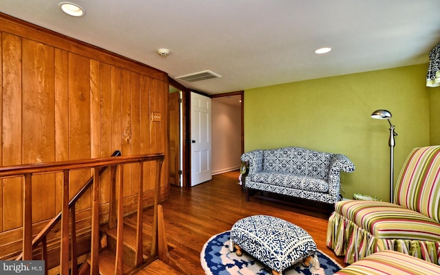 living room featuring dark wood-type flooring