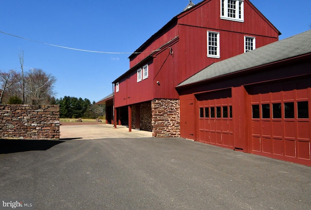 view of side of home featuring a garage