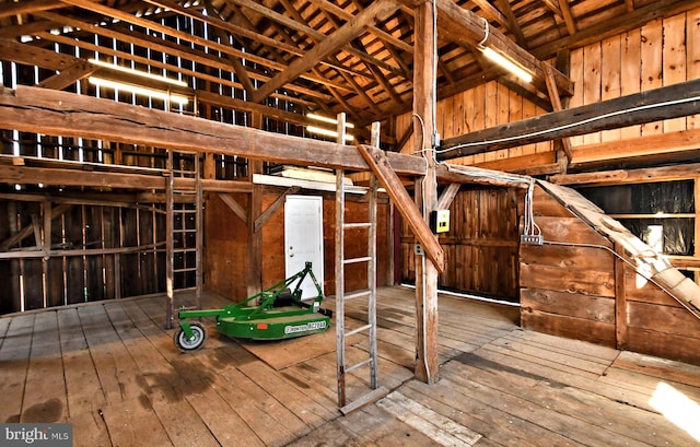 interior space with high vaulted ceiling and dark wood-type flooring