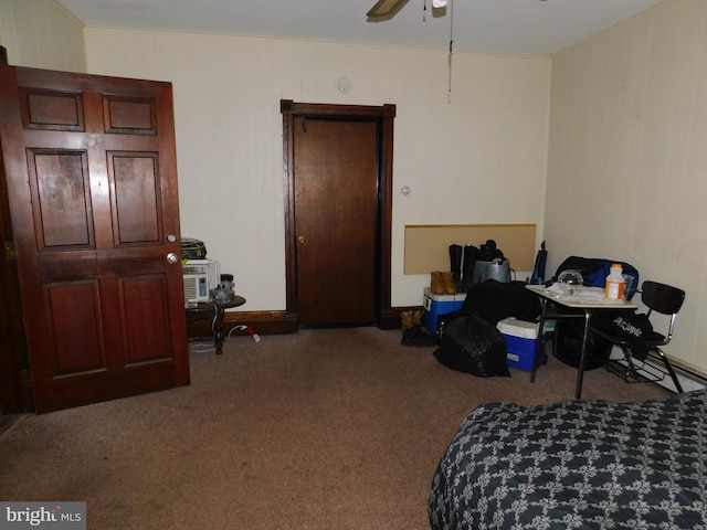 interior space with dark carpet and ceiling fan