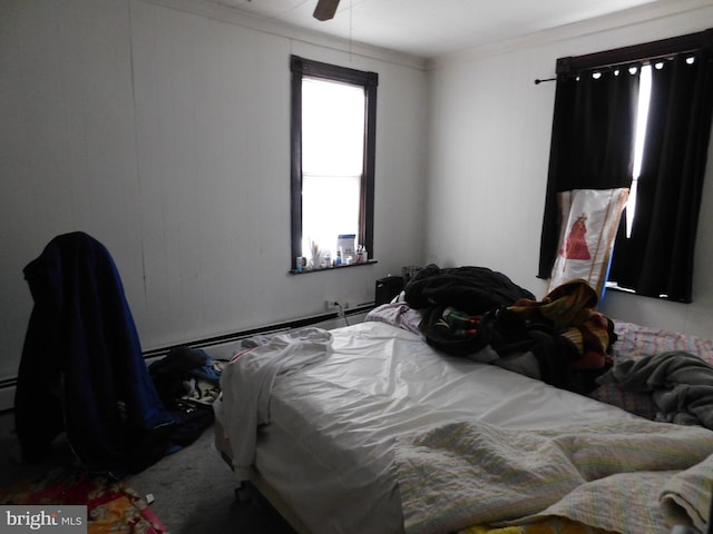 bedroom featuring ceiling fan and dark colored carpet