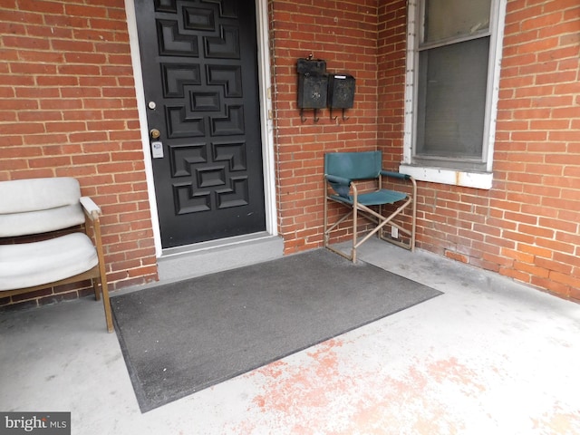 doorway to property with a patio area