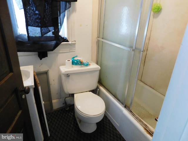 full bathroom featuring toilet, shower / bath combination with glass door, vanity, and tile flooring