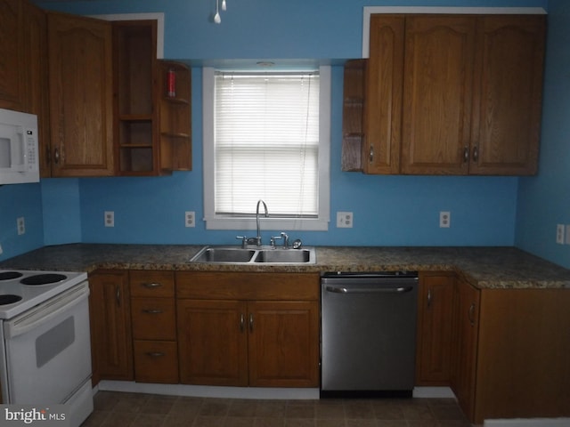 kitchen with white appliances, sink, and light tile floors