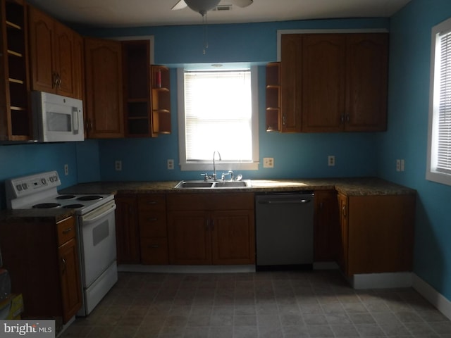 kitchen with ceiling fan, white appliances, plenty of natural light, and light tile floors