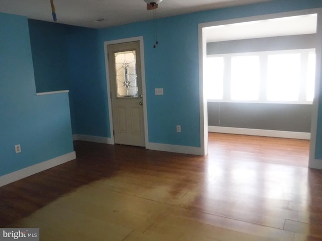 empty room with light hardwood / wood-style floors