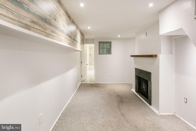 unfurnished living room featuring light colored carpet