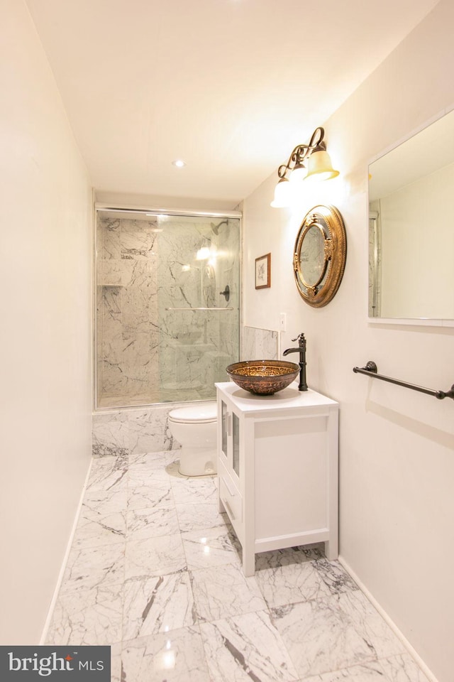 bathroom featuring toilet, tile floors, and vanity