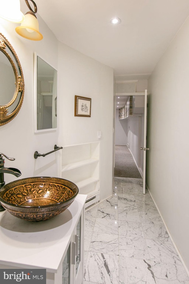 bathroom with tile flooring and vanity