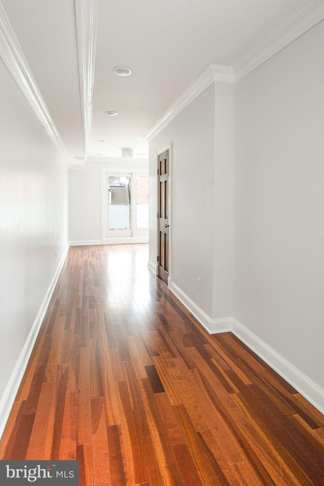 spare room with dark hardwood / wood-style floors and ornamental molding