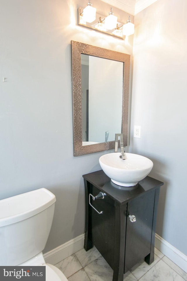 bathroom featuring vanity, tile floors, and toilet