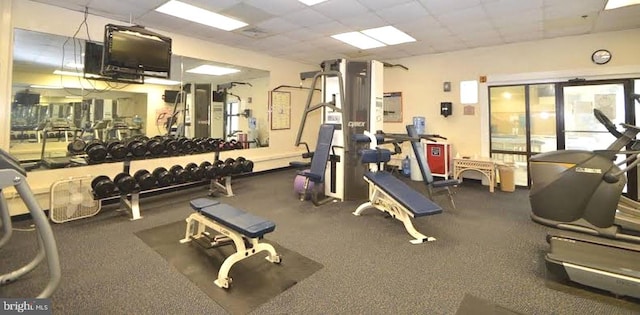 workout area with a drop ceiling