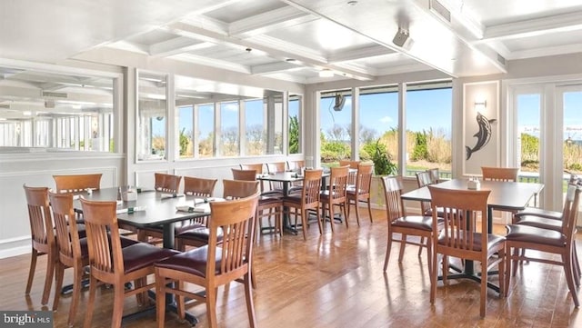 sunroom featuring coffered ceiling and beamed ceiling