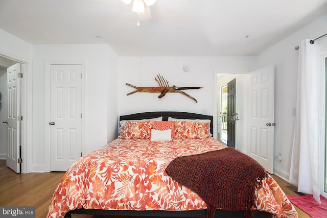 bedroom featuring ceiling fan and hardwood / wood-style floors