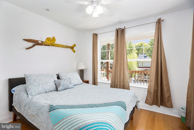 bedroom featuring light hardwood / wood-style floors and ceiling fan