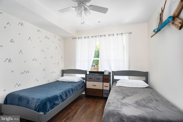 bedroom featuring ceiling fan and dark wood-type flooring