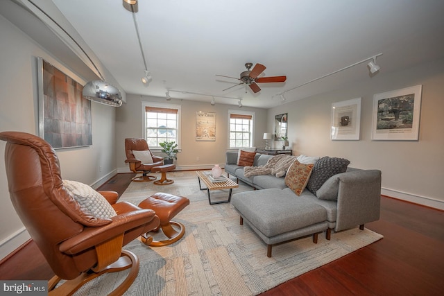 living room with rail lighting, hardwood / wood-style floors, and ceiling fan