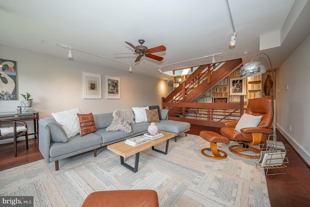 living room with wood-type flooring, ceiling fan, and track lighting