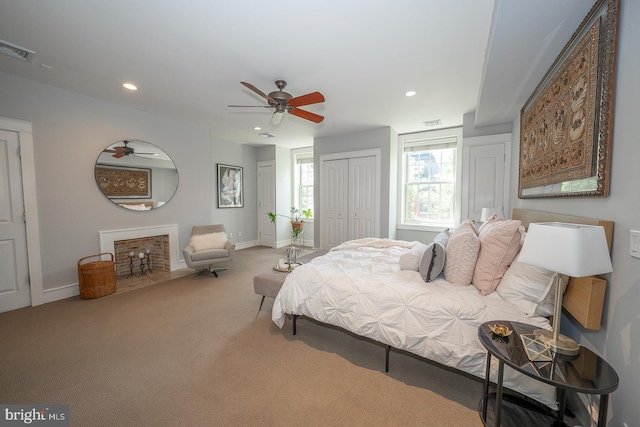 bedroom featuring ceiling fan and carpet