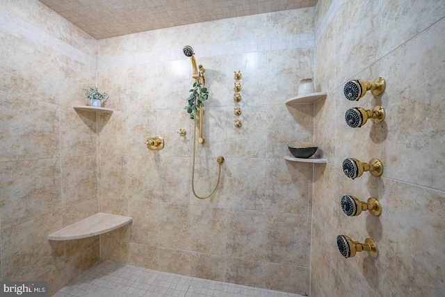 bathroom featuring a tile shower