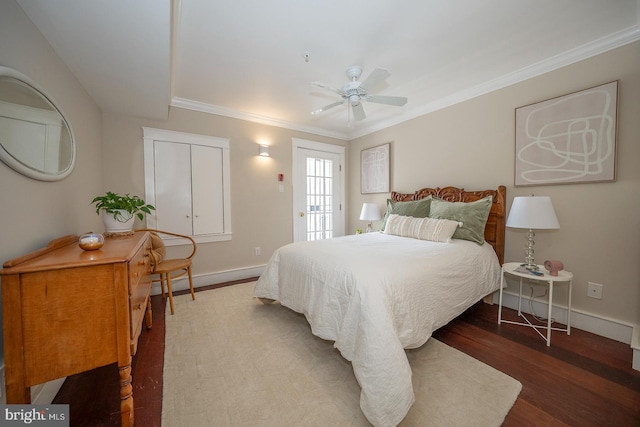 bedroom featuring ornamental molding, wood-type flooring, and ceiling fan