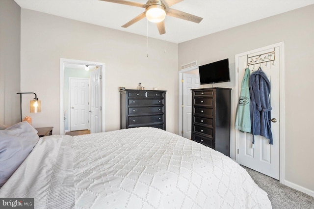 carpeted bedroom featuring ceiling fan