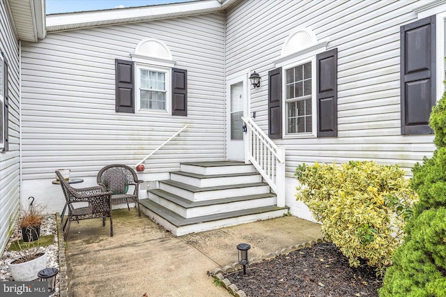 doorway to property featuring a patio