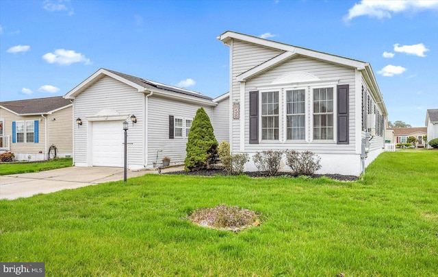 view of front of house featuring a front lawn and a garage