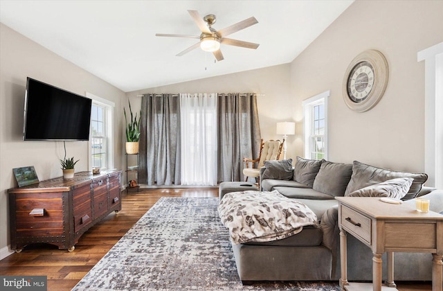 living room with vaulted ceiling, ceiling fan, and dark hardwood / wood-style flooring