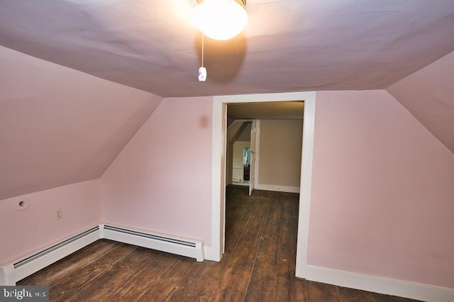 bonus room with lofted ceiling, dark hardwood / wood-style flooring, and a baseboard heating unit