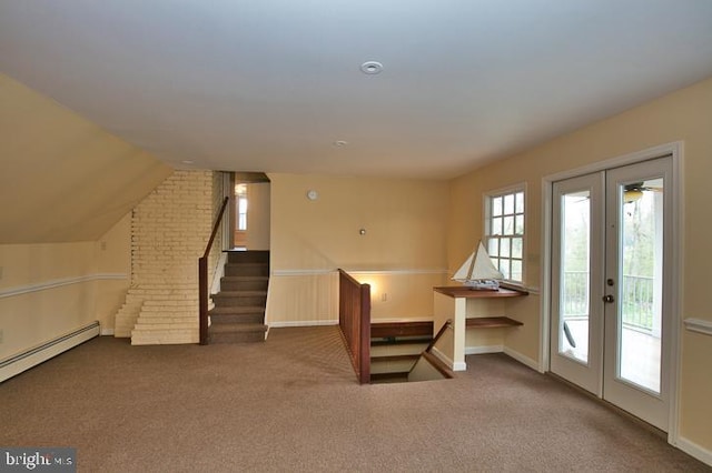 interior space featuring french doors, a baseboard radiator, and lofted ceiling