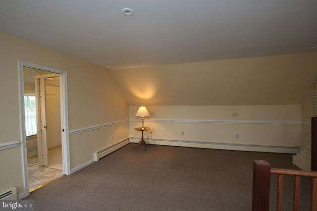 bonus room with a baseboard radiator, lofted ceiling, and carpet flooring