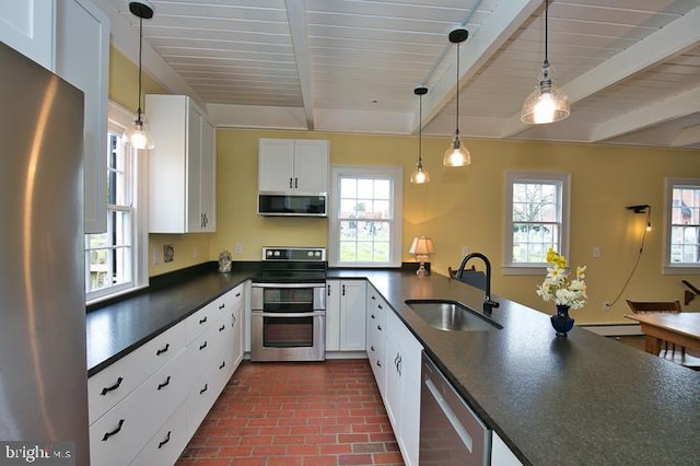 kitchen with sink, white cabinets, beam ceiling, stainless steel appliances, and decorative light fixtures