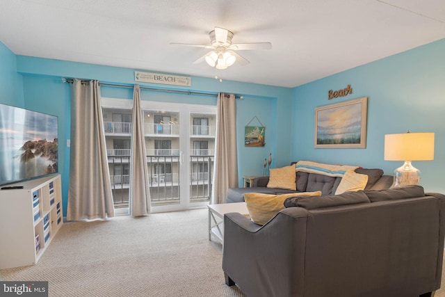 living room with light carpet and ceiling fan