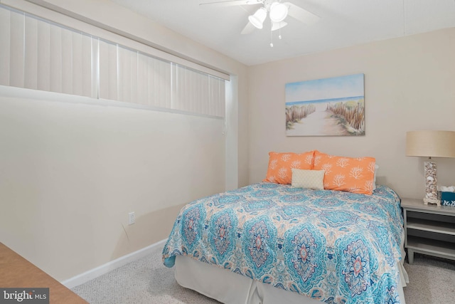 bedroom featuring ceiling fan and carpet floors