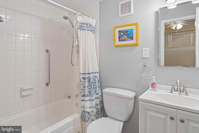 full bathroom featuring vanity, toilet, shower / bath combo with shower curtain, and ceiling fan