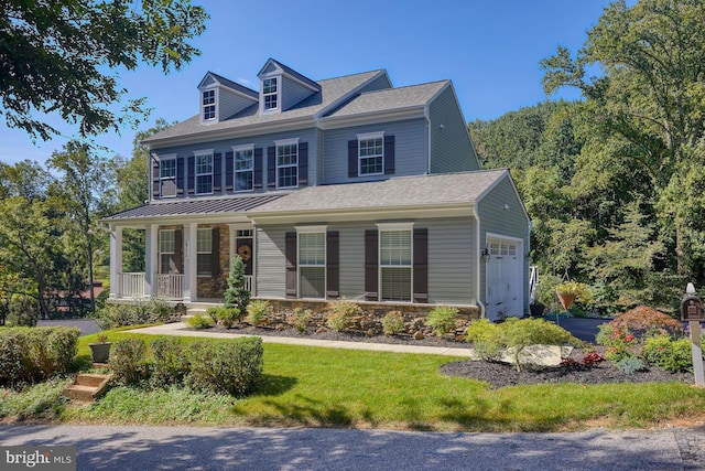 view of front of house featuring covered porch and a garage