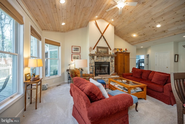 living room with lofted ceiling, ceiling fan, light carpet, wooden ceiling, and a stone fireplace