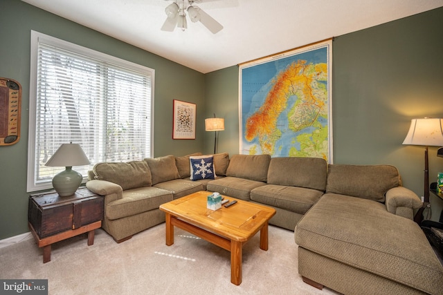 carpeted living room featuring ceiling fan and a wealth of natural light