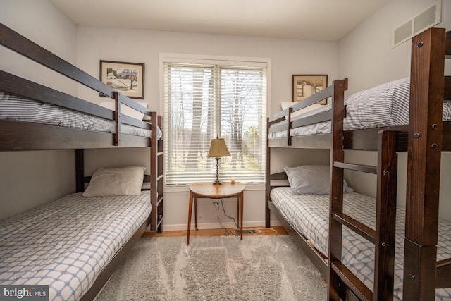 bedroom featuring dark hardwood / wood-style flooring