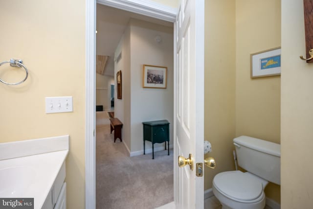 bathroom with toilet and vanity