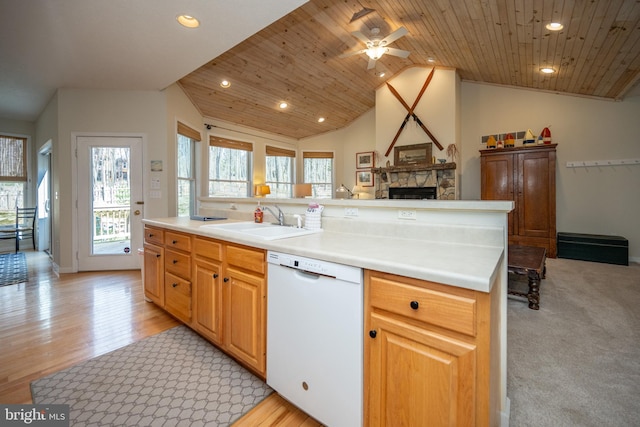 kitchen with wood ceiling, white dishwasher, lofted ceiling, and a fireplace