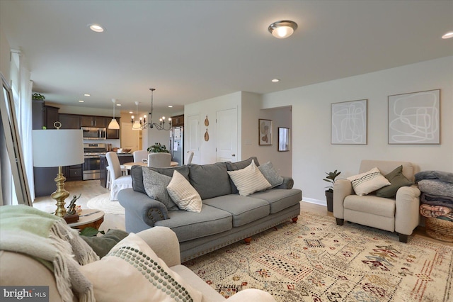 living room with a notable chandelier