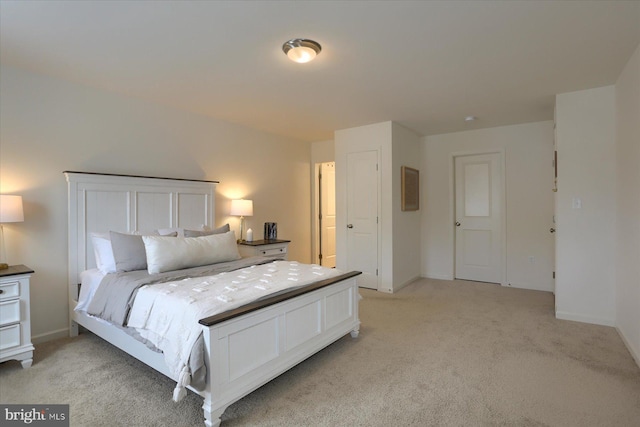 bedroom featuring light colored carpet