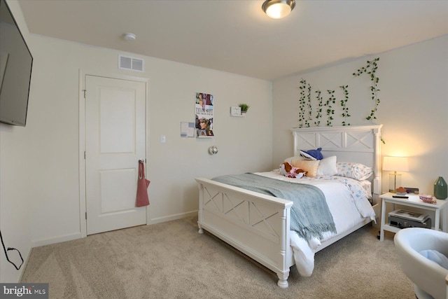 bedroom with light colored carpet