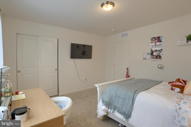 carpeted bedroom with a closet