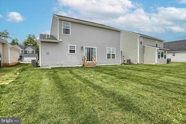 back of property featuring a lawn and central air condition unit