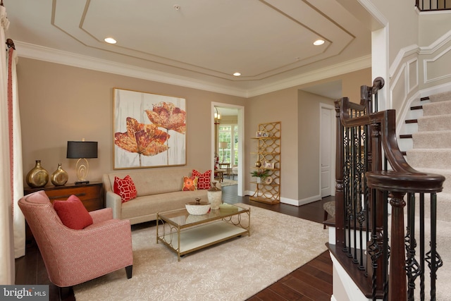 living room with ornamental molding and wood-type flooring