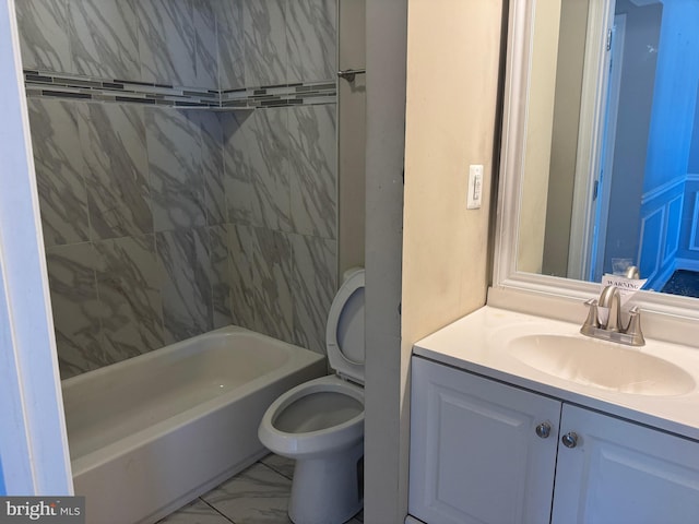 full bathroom featuring tile floors, vanity, toilet, and tiled shower / bath